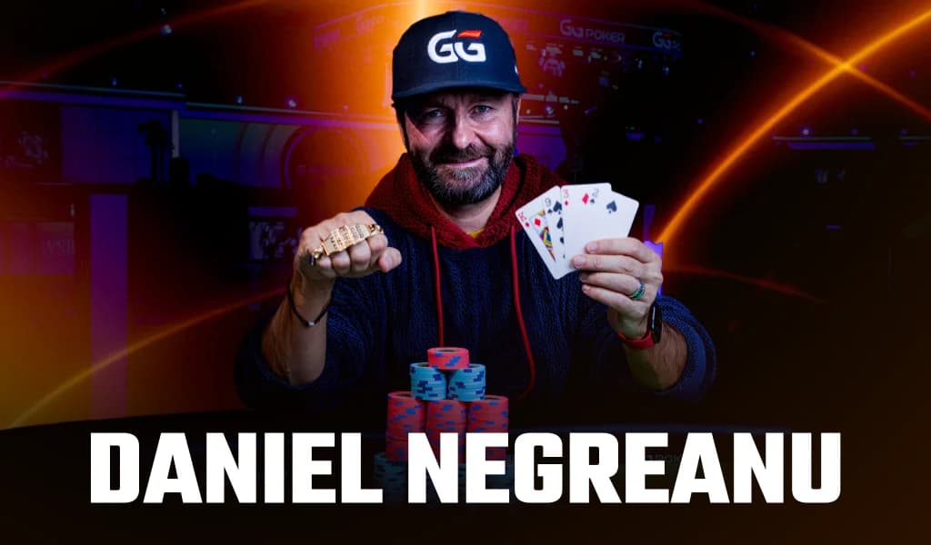 Daniel Negreanu holds a WSOP bracelet and the King, nine, three, and two he won it with.