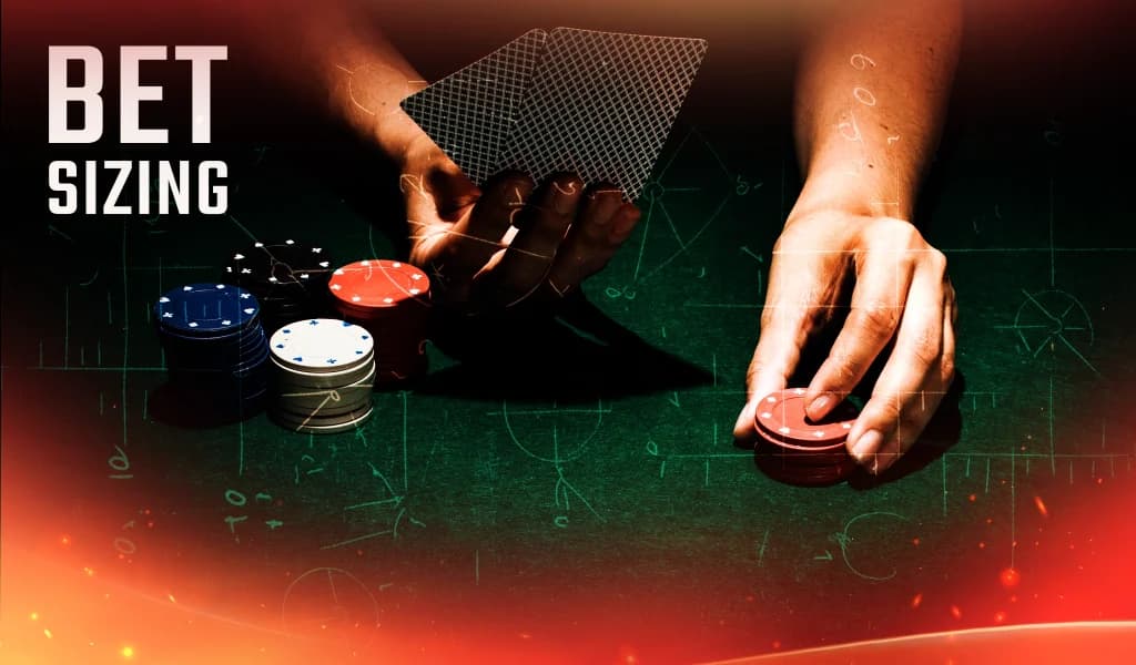 Hand placing red poker chips beside a stack of blue, white, and black chips on a green felt table.