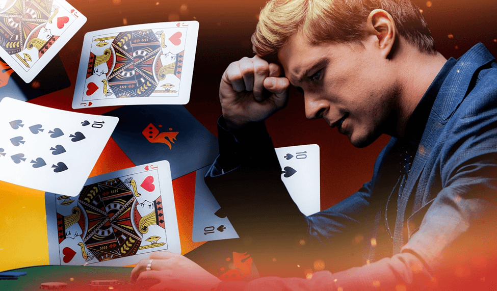 Frustrated man at a blackjack table with cards flying around him.