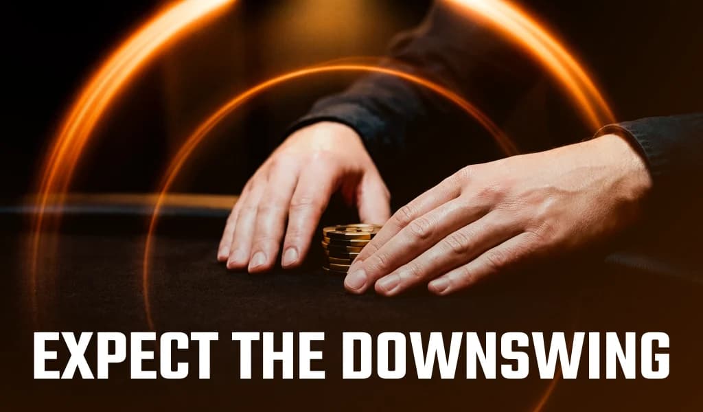 Two hands rest near a small stack of poker chips, with text reading Expect the Downswing.