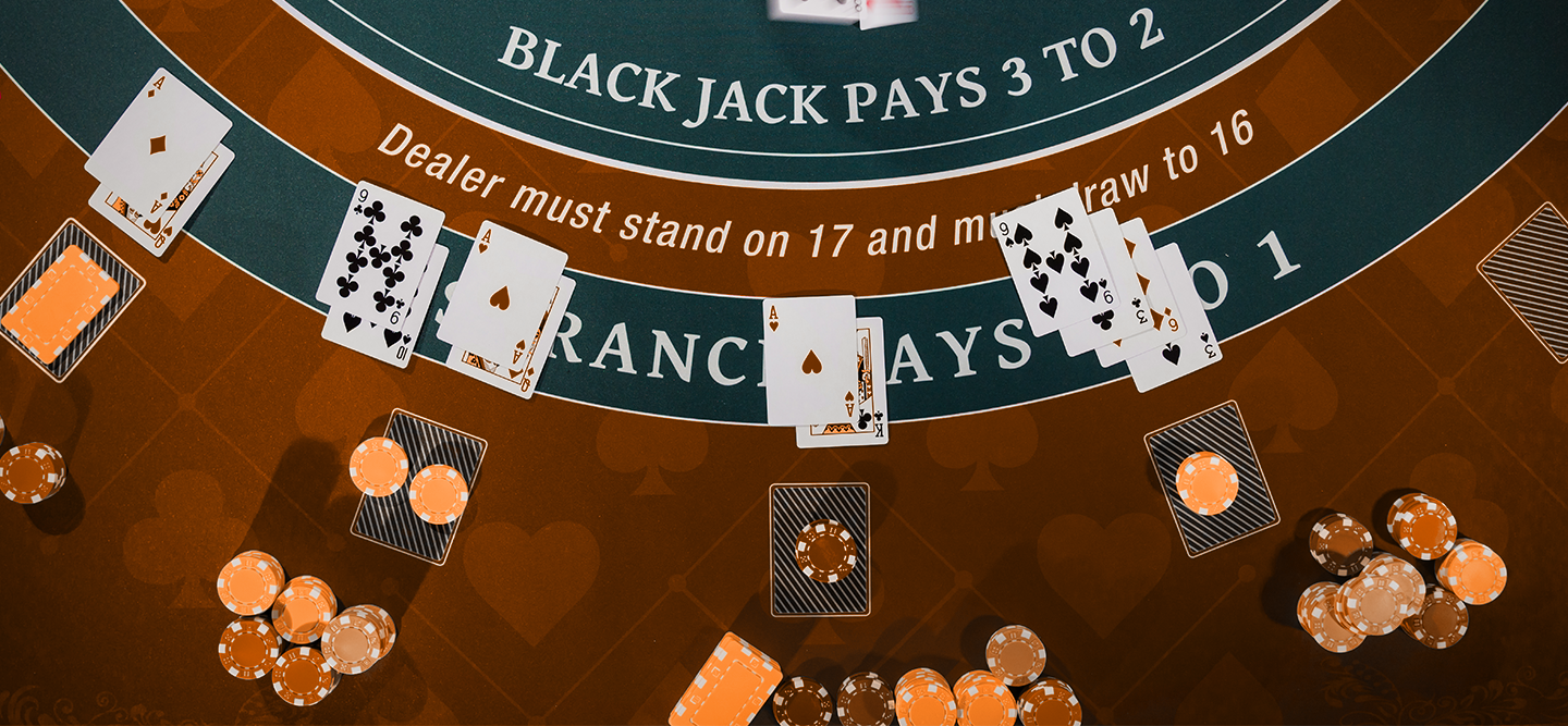 Blackjack table with placed cards and chips.