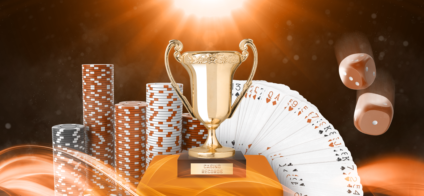 Gold Trophy in the spotlight on a platform with stacked casino chips and cards in the background with falling dice.