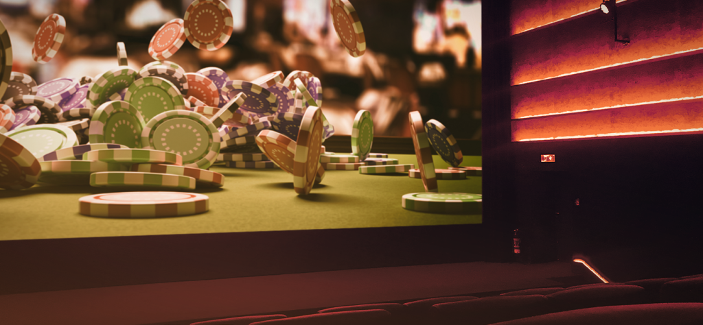 Casino chips on a movie screen in a movie theater.