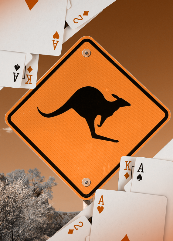 An orange caution sign with a kangaroo surrounded by cards.