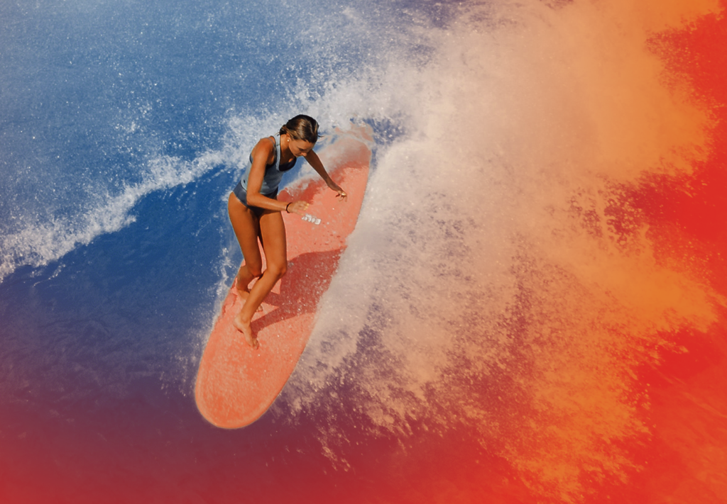 The biggest gambler in the surfing world, Tyler Wright, on a surfboard in the middle of the ocean.