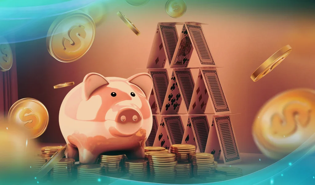 Piggy bank and house of cards surrounded by gold coins, symbolizing financial risk and savings.