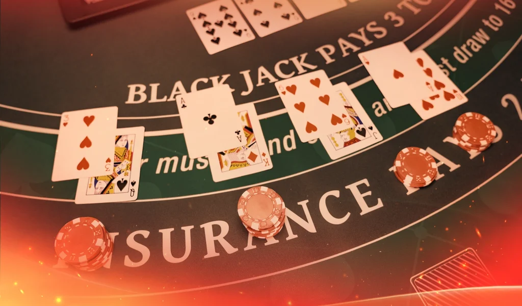 A blackjack table with multiple hands of cards dealt, stacks of red casino chips, and the words "BLACKJACK PAYS 3 TO 2" visible.