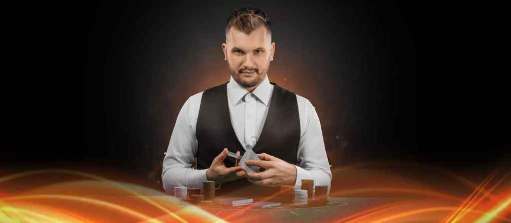 suited dealer shuffling cards in hand standing in front of a blackjack table over a black background and flaming orange foreground