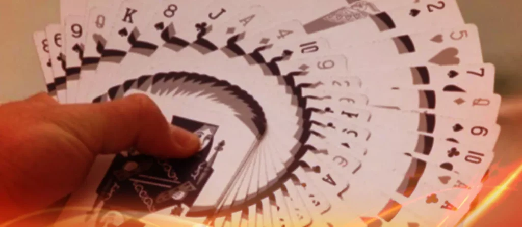 deck of cards spread out using hand